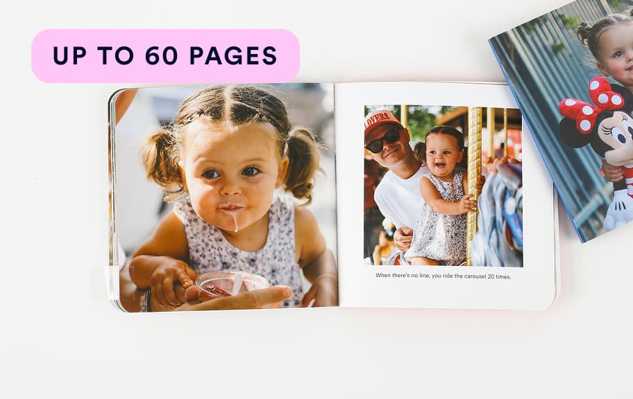 Open photo book showing a young child eating ice cream on one page and riding a carousel with an adult on the other, with a Minnie Mouse image partially visible nearby.
