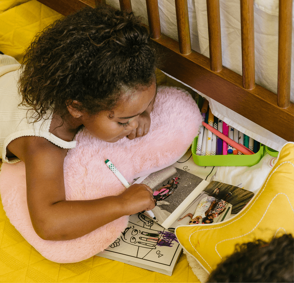 Toddler reading a Monthly Mini photo book
