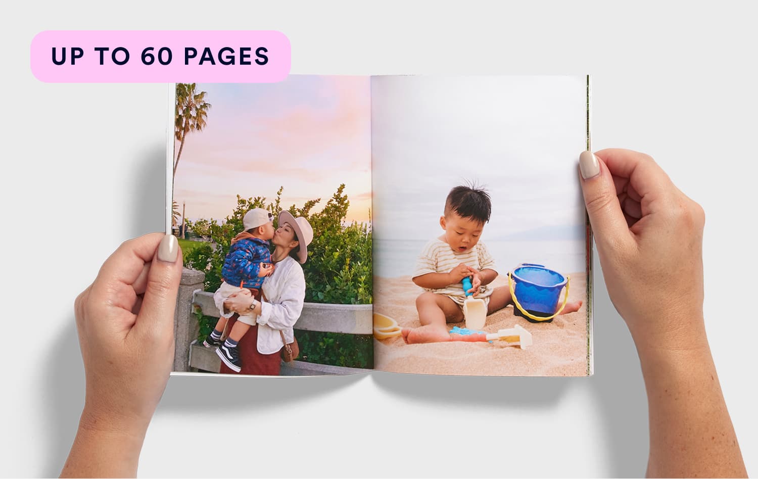 Open Monthbook held in hands showing family beach photos, up to 60 pages