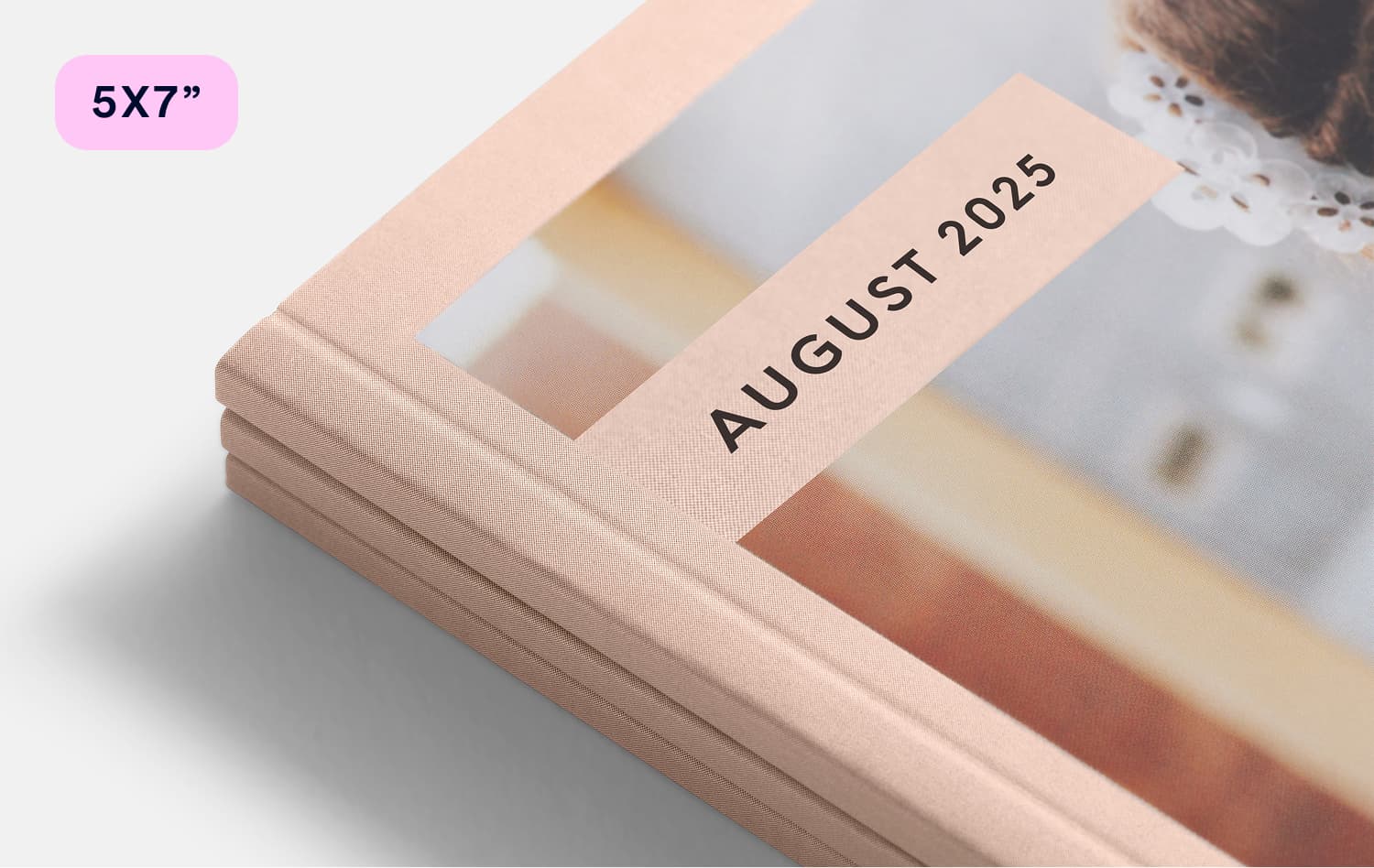 Close-up of a 5x7 inch softcover Monthbook spine labeled August 2025