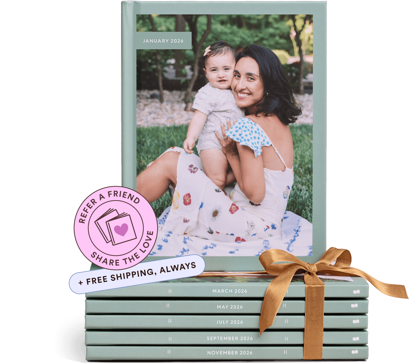 A stack of Chatbooks photo books with a gold ribbon